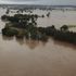 Homes and roads engulfed as heavy rain sparks flash floods in Australia
