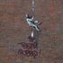 Banksy mural on side of former prison defaced with rival’s name