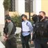 Pilot accused of murdering British wife arrives at Greek court with armed police escort