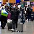 At least 4,500 flights around the world cancelled as COVID causes travel chaos
