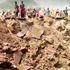 At least 17 killed and 59 hurt in mining truck crash explosion which leaves huge crater